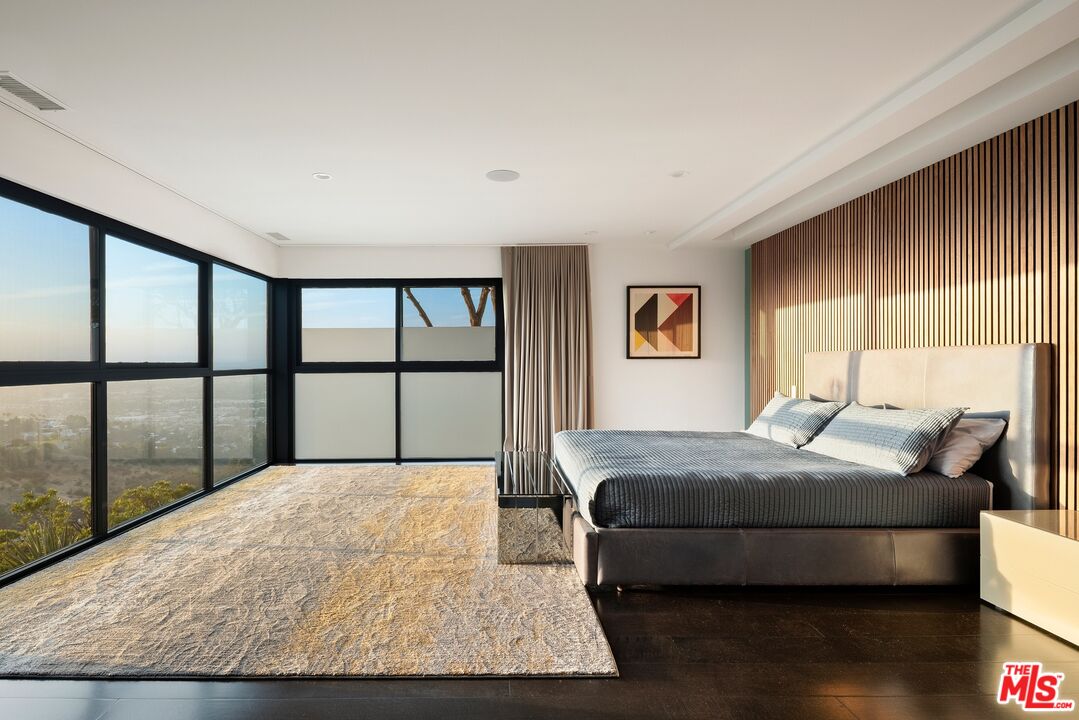 3337 Beverly Ranch Road Beverly Hills, CA 90210 - Photo 12 of 39 a bedroom with a large bed and a large window