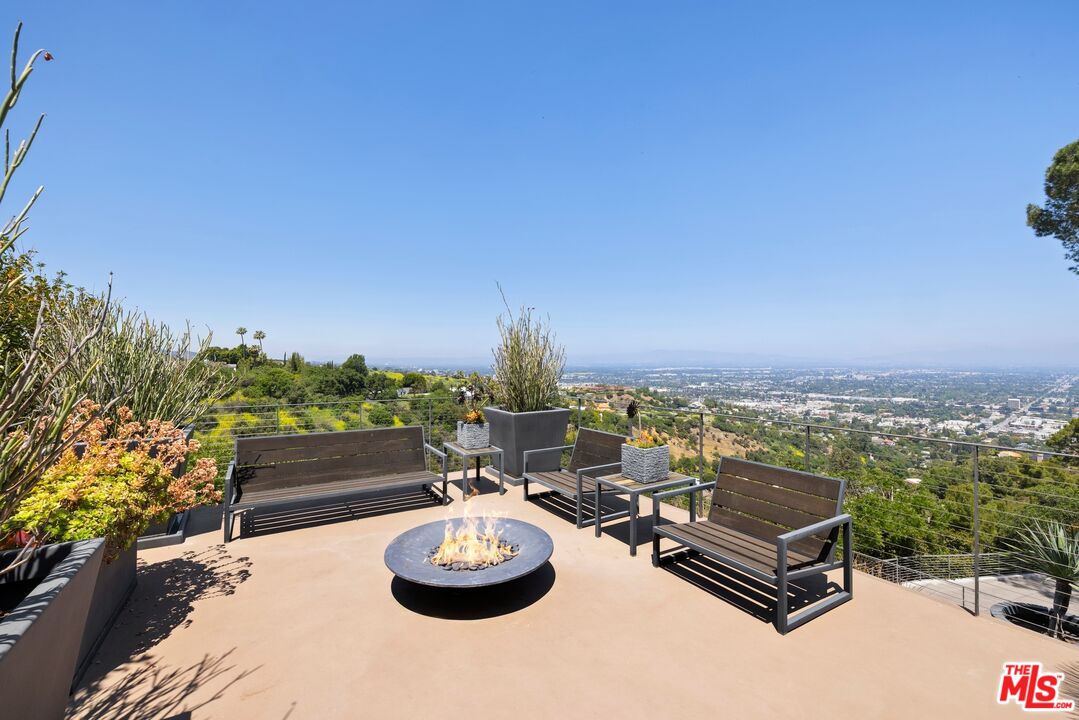 3337 Beverly Ranch Road Beverly Hills, CA 90210 - Photo 15 of 39 a view of a terrace with furniture and a potted plant