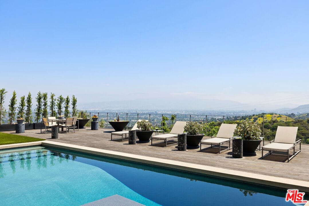 3337 Beverly Ranch Road Beverly Hills, CA 90210 - Photo 2 of 39 a view of swimming pool with outdoor seating