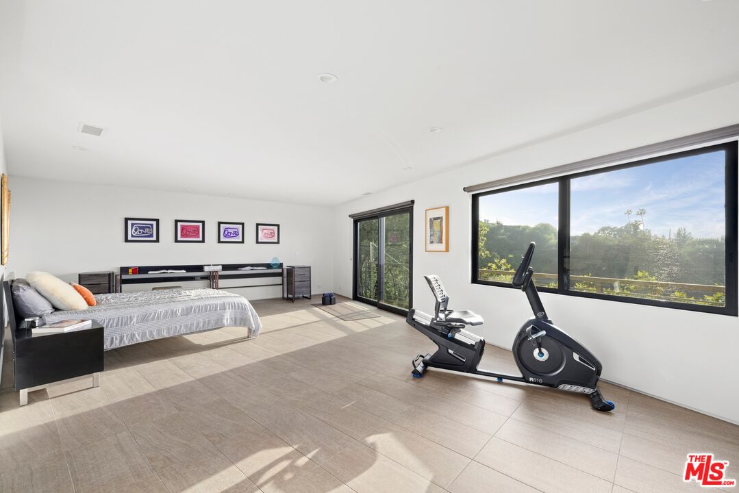 3337 Beverly Ranch Road Beverly Hills, CA 90210 - Photo 26 of 39 a room with gym equipment and a large window