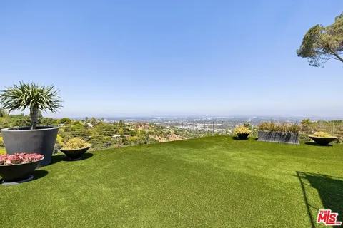 a view of a lake with a house in the background