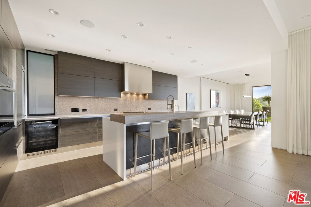 3337 Beverly Ranch Road Beverly Hills, CA 90210 - Photo 8 of 39 a large white kitchen with a large window