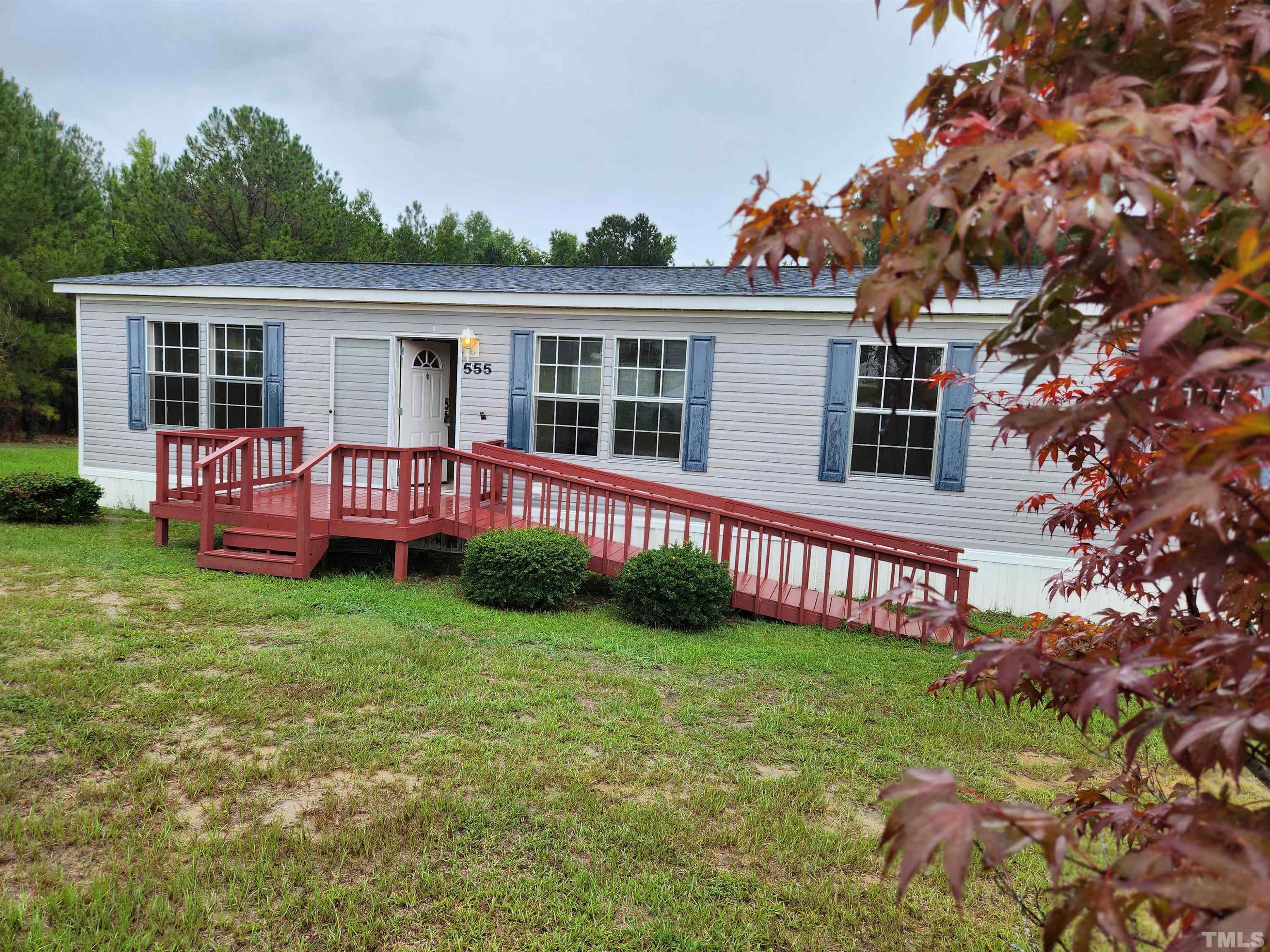 555 Massengill Pond Road Angier, NC 27501 - Photo 1 of 36 a view of a house with a yard and sitting area