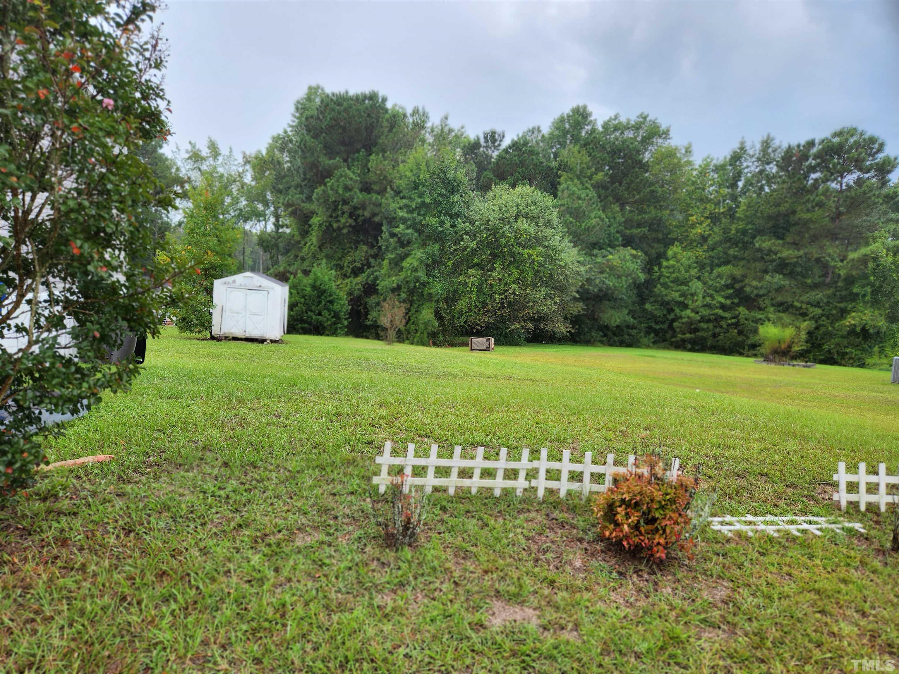555 Massengill Pond Road Angier, NC 27501 - Photo 11 of 36 a view of a golf course with a bench