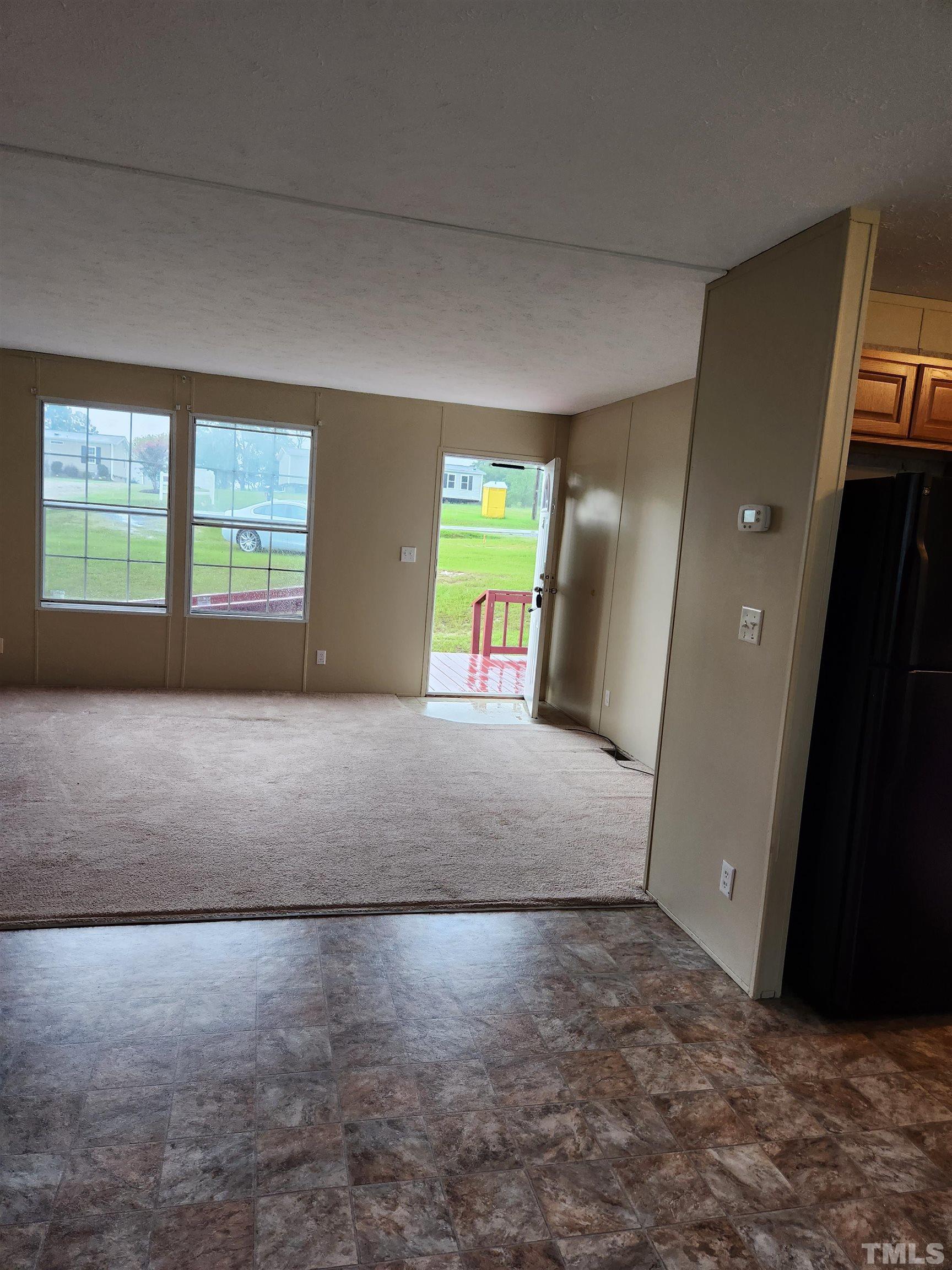 555 Massengill Pond Road Angier, NC 27501 - Photo 19 of 36 a view of livingroom with window and stairs