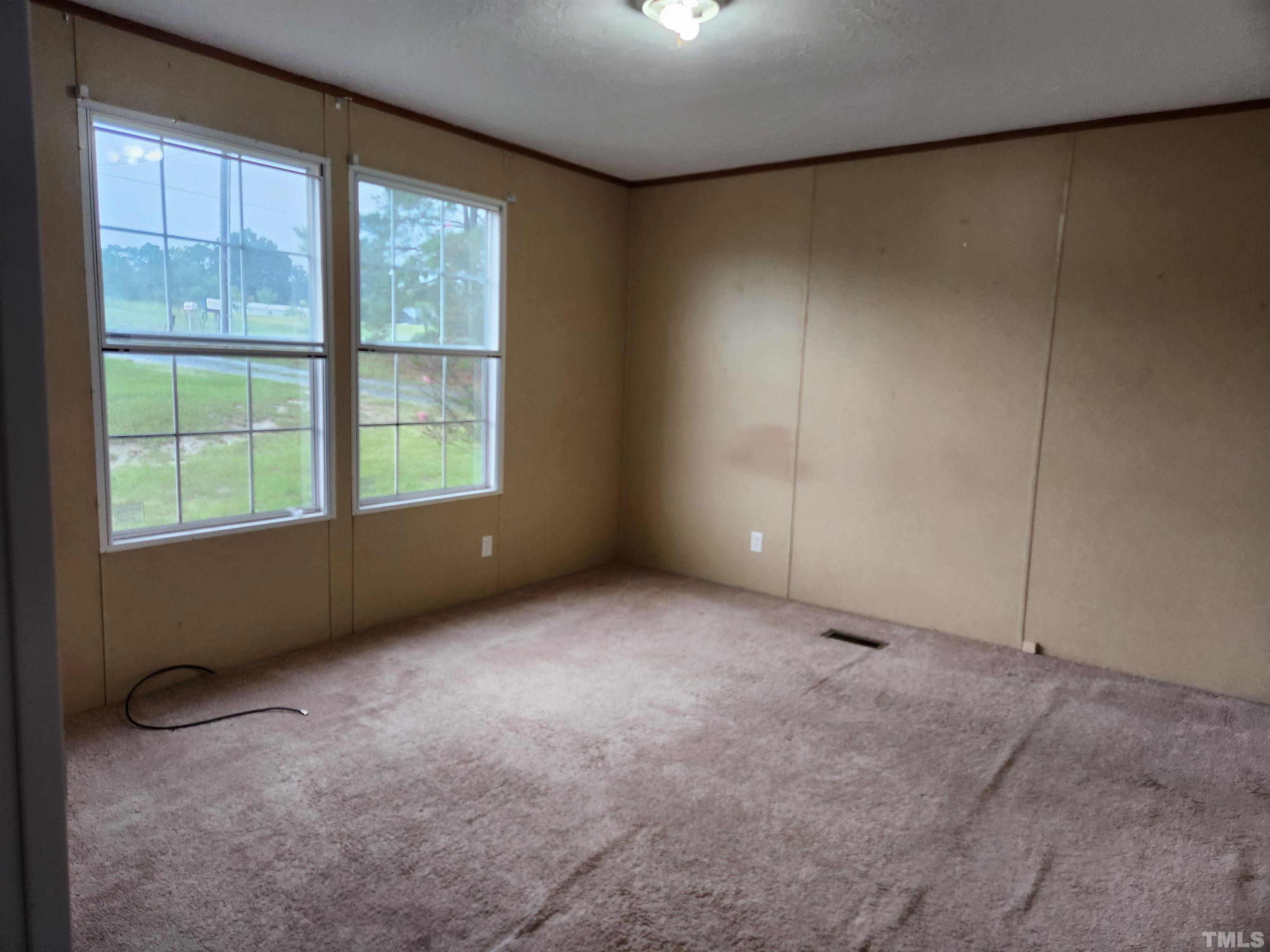 555 Massengill Pond Road Angier, NC 27501 - Photo 20 of 36 an empty room with windows