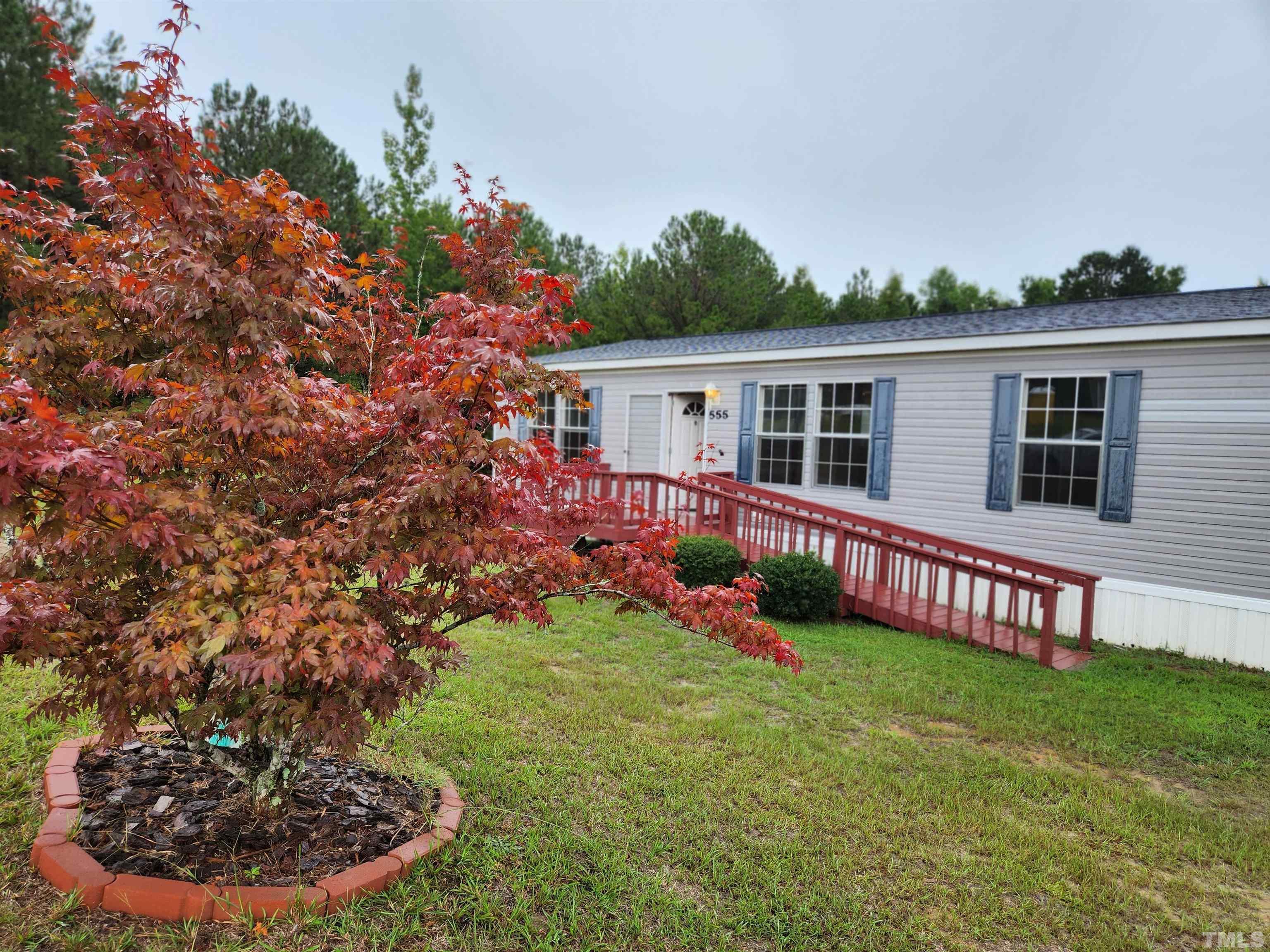 555 Massengill Pond Road Angier, NC 27501 - Photo 2 of 36 a view of a house with a yard and potted plants