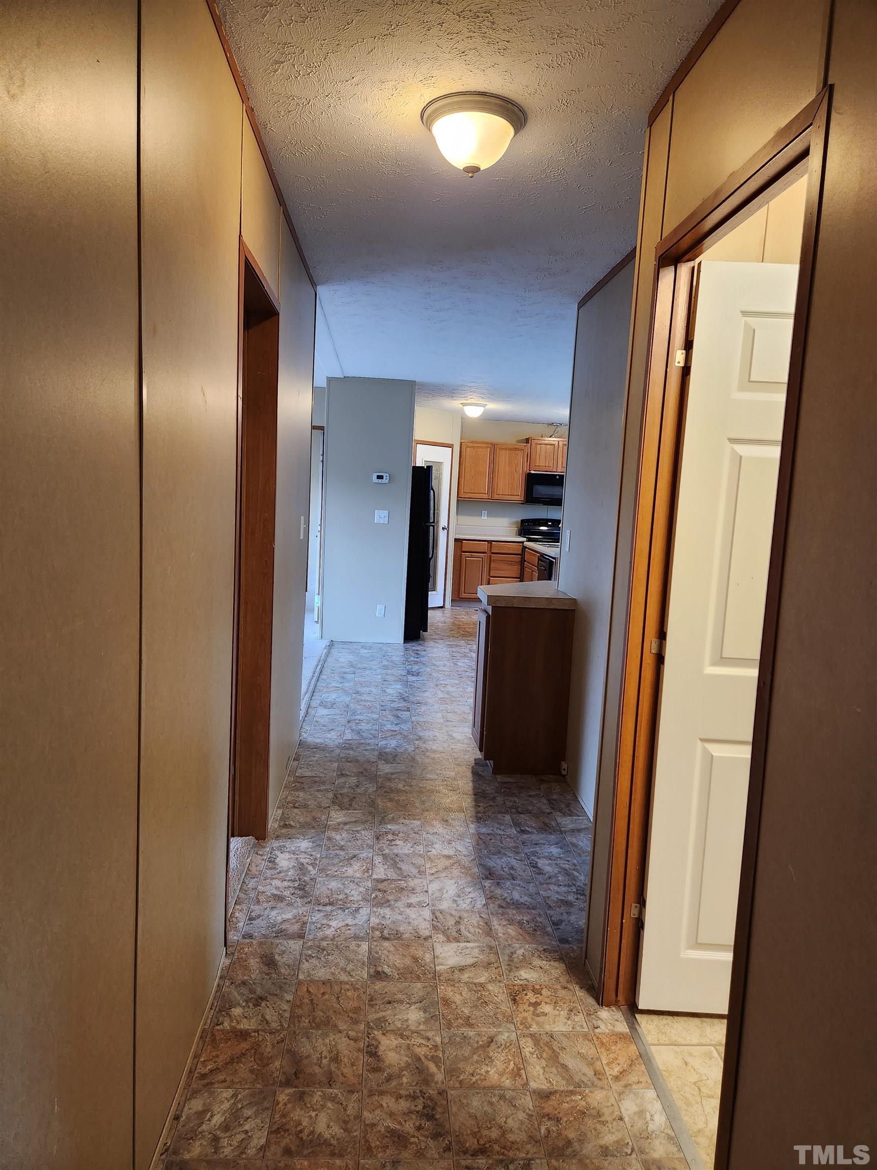 555 Massengill Pond Road Angier, NC 27501 - Photo 27 of 36 a view of a refrigerator in kitchen and a window