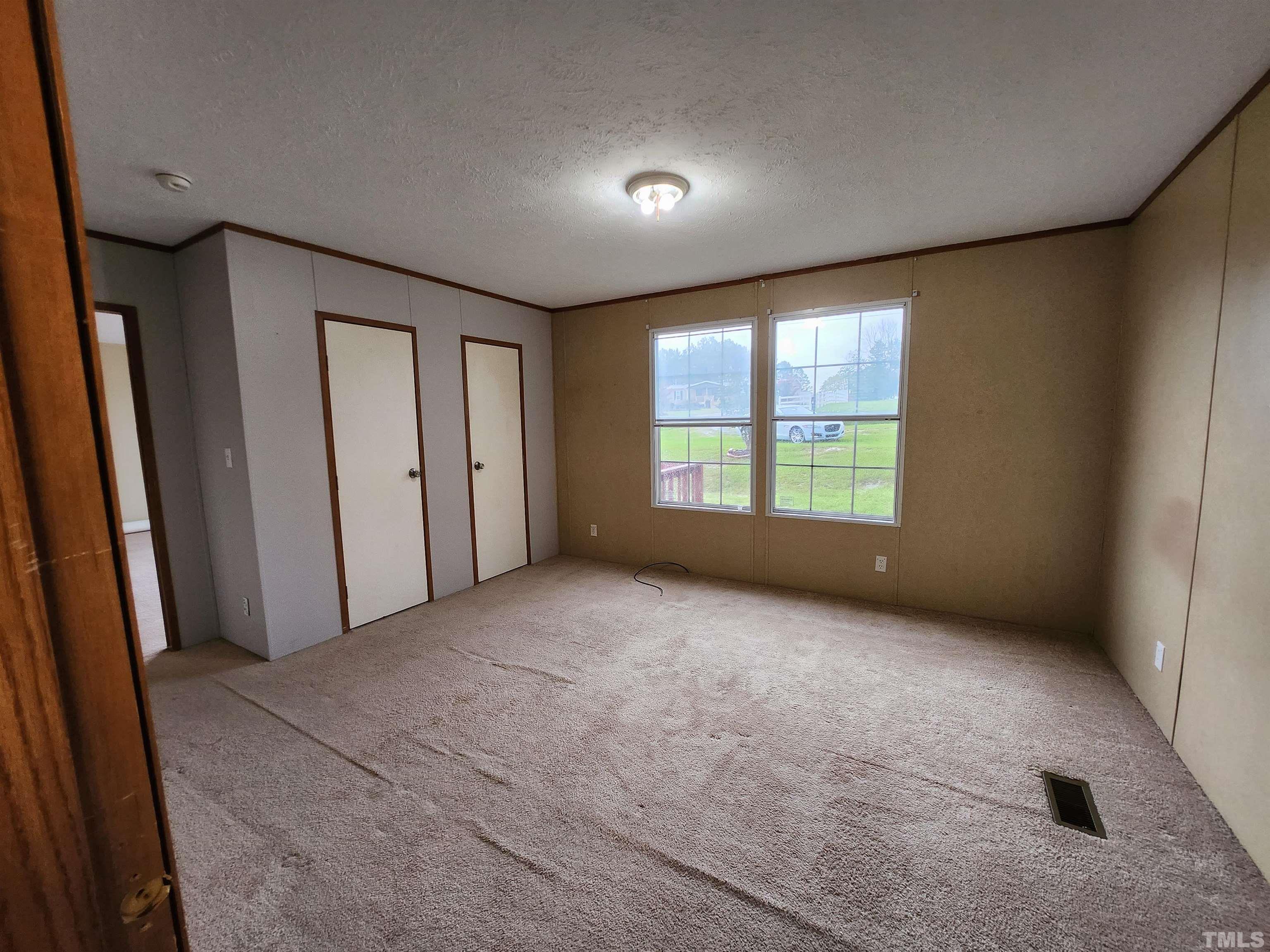 555 Massengill Pond Road Angier, NC 27501 - Photo 30 of 36 an empty room with windows