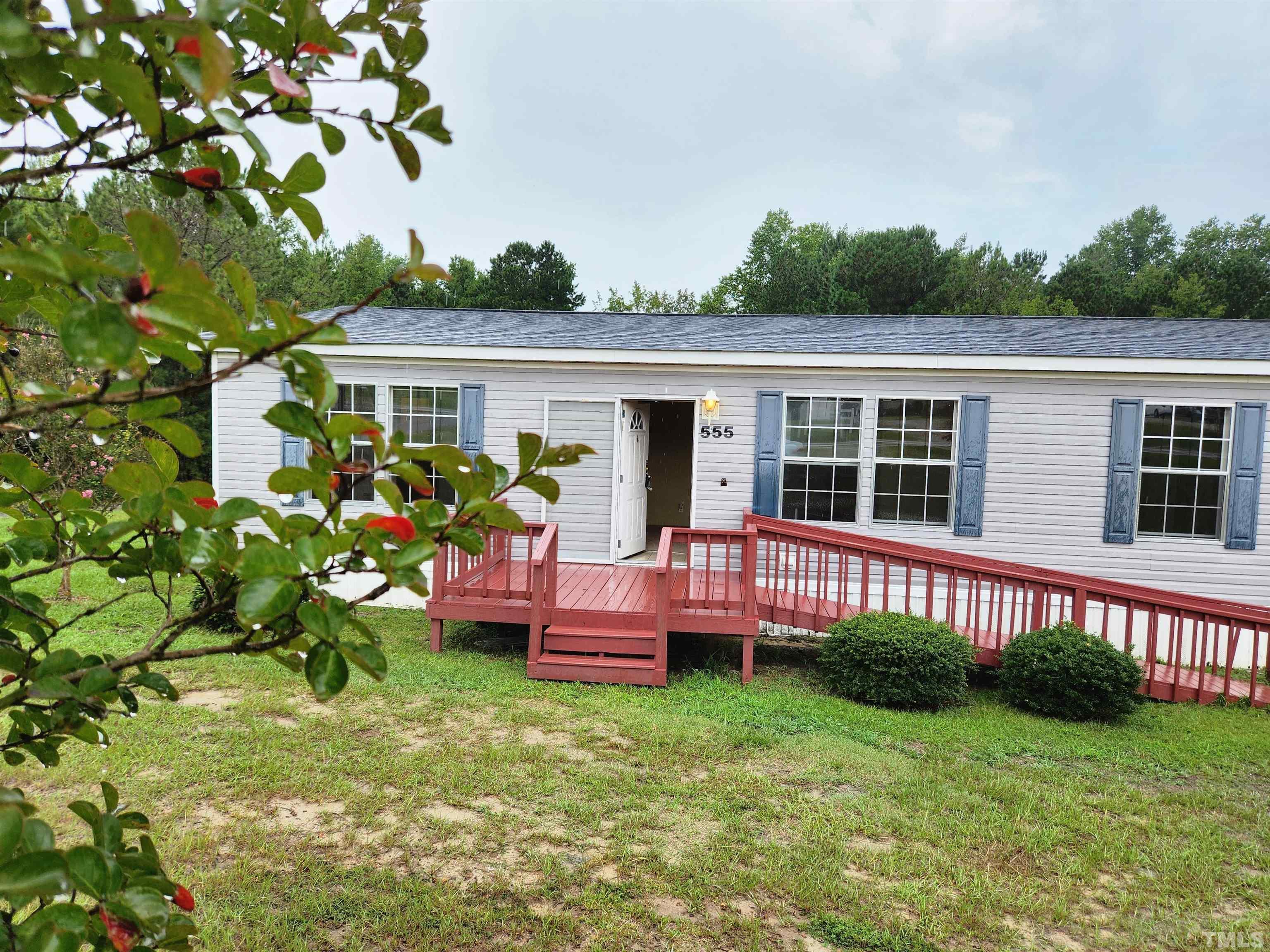 555 Massengill Pond Road Angier, NC 27501 - Photo 3 of 36 a front view of a house with garden