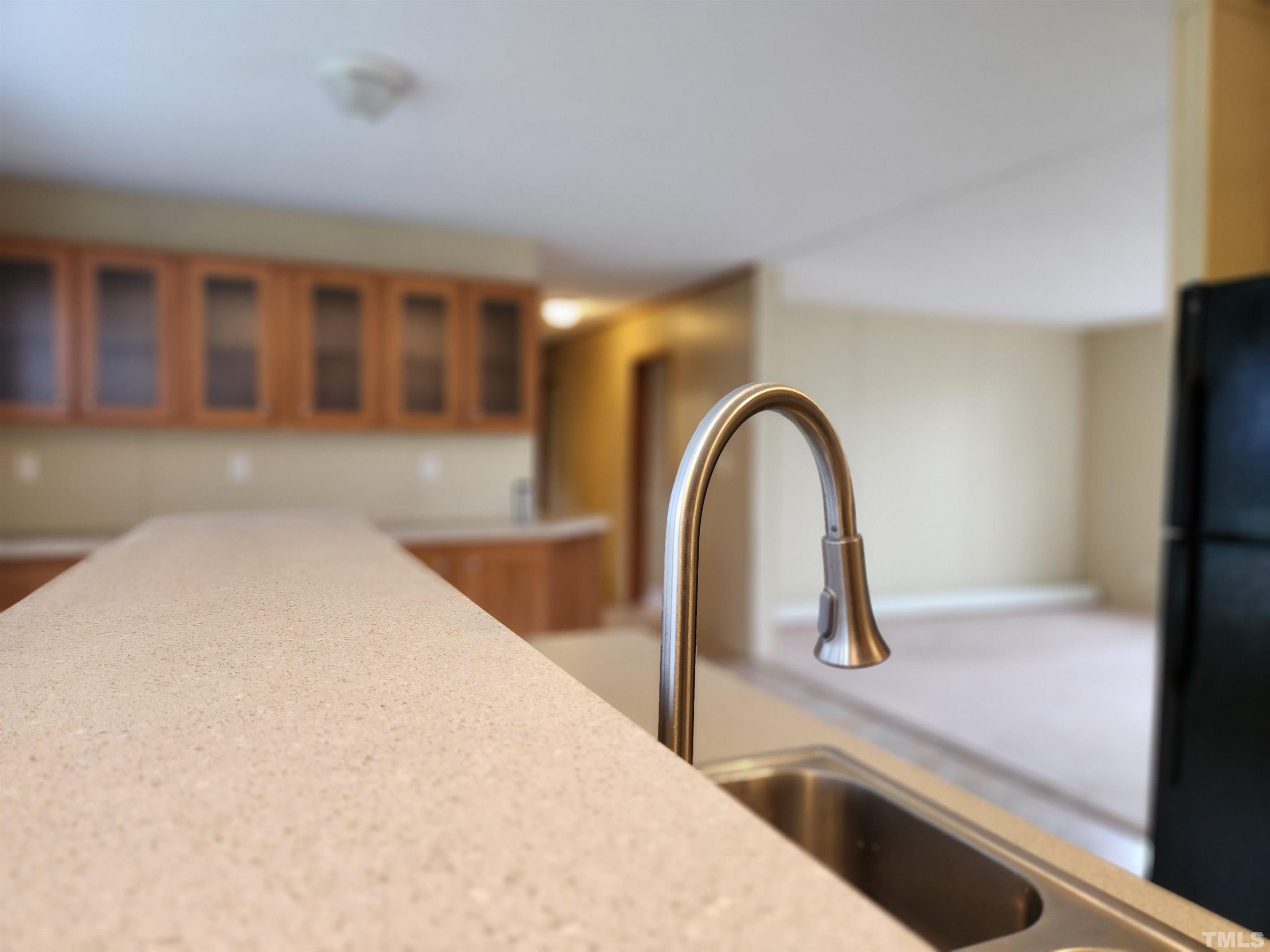 555 Massengill Pond Road Angier, NC 27501 - Photo 36 of 36 a close view of a sink and dishwasher with wooden floor