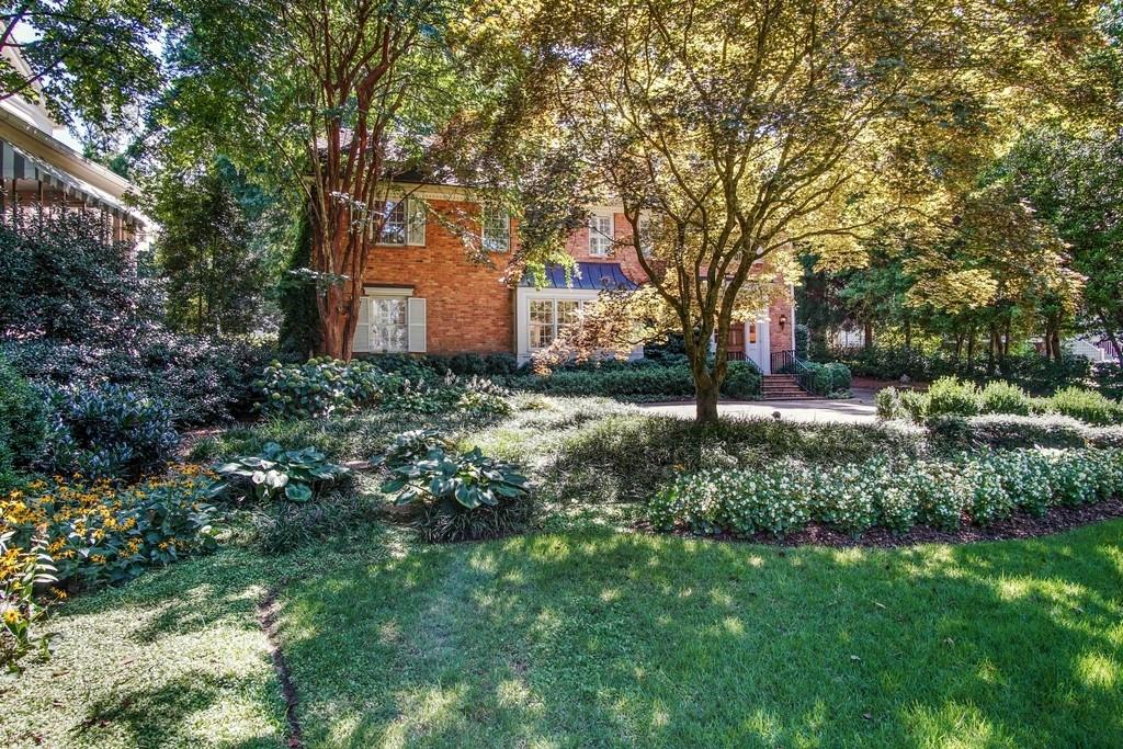 a backyard of a house with lots of green space