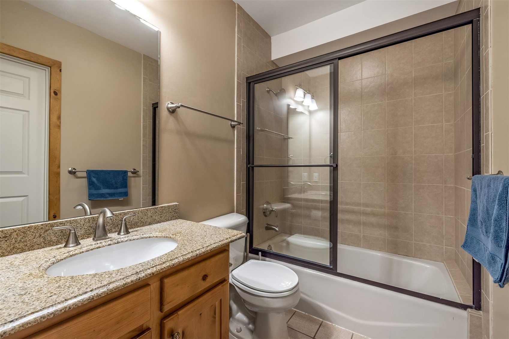 71 Starfire Lane, Unit 1978 Keystone, CO 80435 - Photo 25 of 40 a bathroom with a granite countertop sink toilet and shower