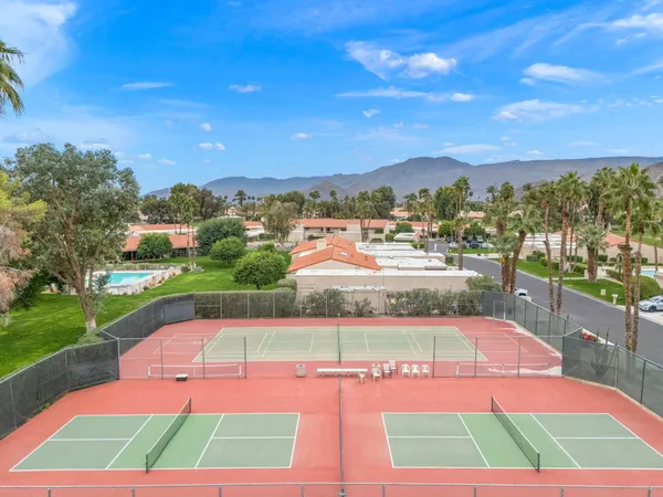 a living room with couch and a large window