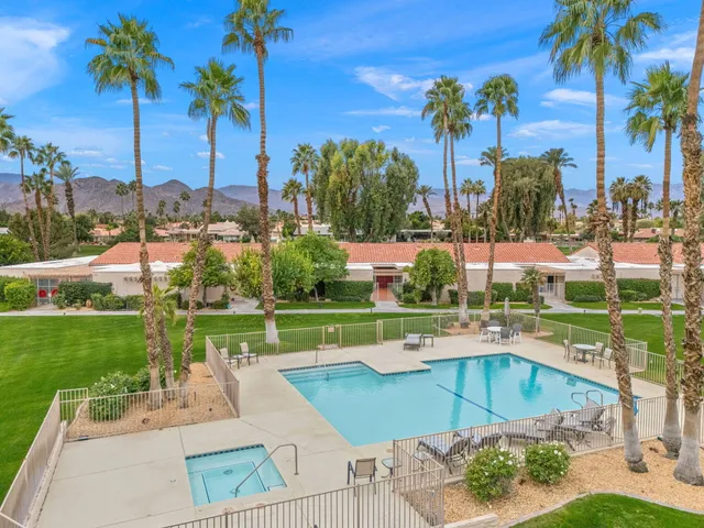 a dining room with furniture water view and a flat screen tv