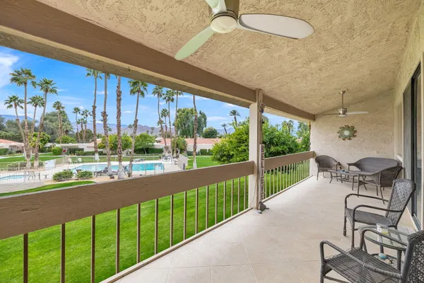 a kitchen with granite countertop white cabinets and stainless steel appliances