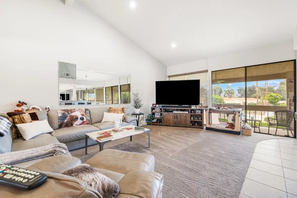 a spacious bathroom with a double vanity sink and a mirror