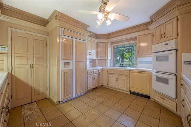 a kitchen with a refrigerator a sink and dishwasher