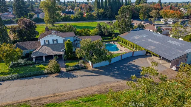 an aerial view of a house with a garden