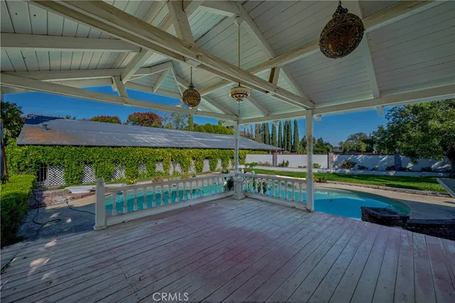 a view of an outdoor space and deck in the backyard