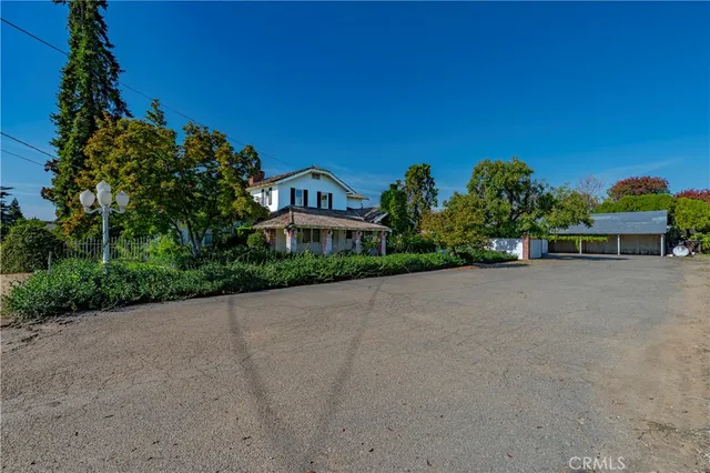 a view of a street with a building in the background