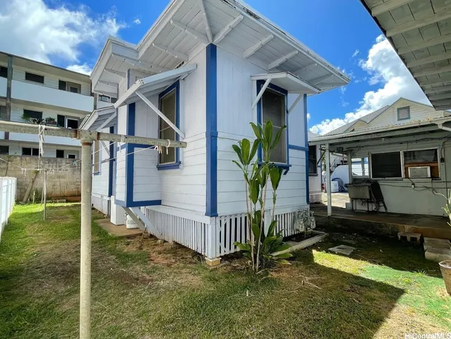 a view of house with swimming pool outdoor seating