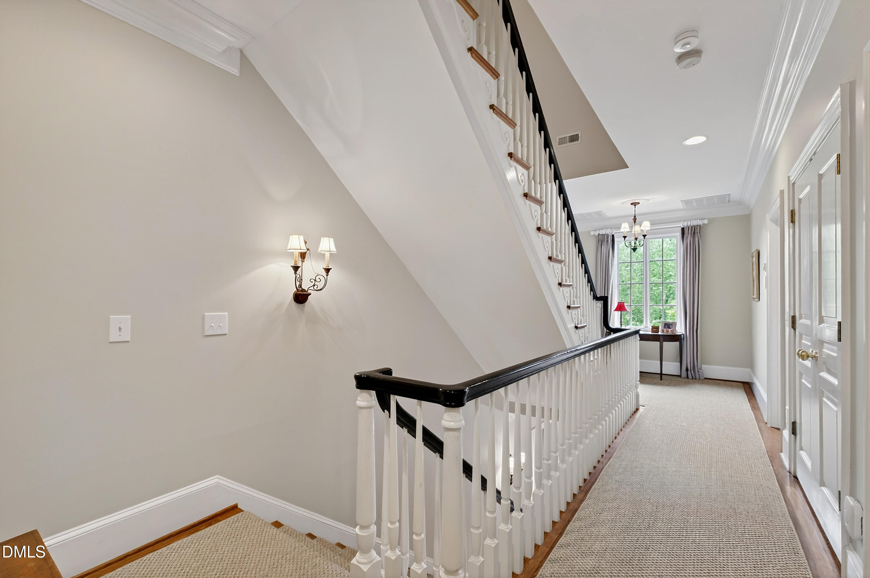 2536 Wake Drive Raleigh, NC 27608 - Photo 30 of 74 a view of a hallway with wooden floor and staircase