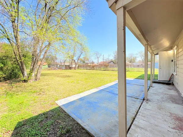 a view of an swimming pool with an outdoor space and seating area