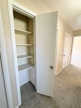 a view of an empty walk in closet