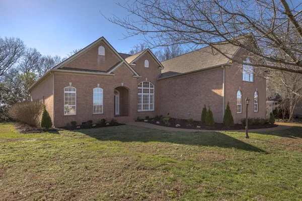 a front view of a house with a yard