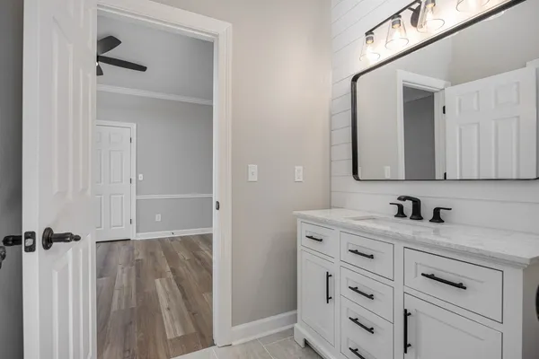 a bathroom with a bathtub and a toilet