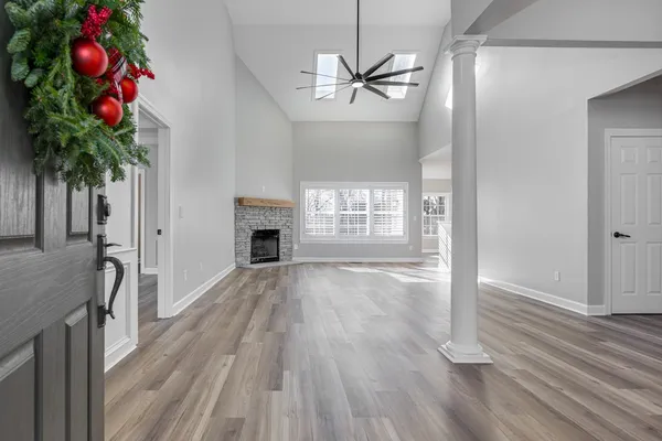 wooden floor in an empty room with a window