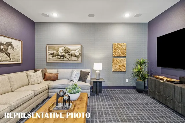 a dining room with furniture large windows and wooden floor
