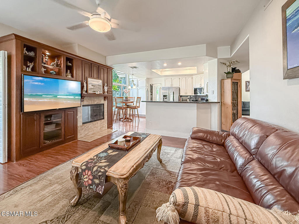 7204 University Drive Moorpark, CA 93021 - Photo 14 of 57 a living room with furniture flat screen tv and a fireplace