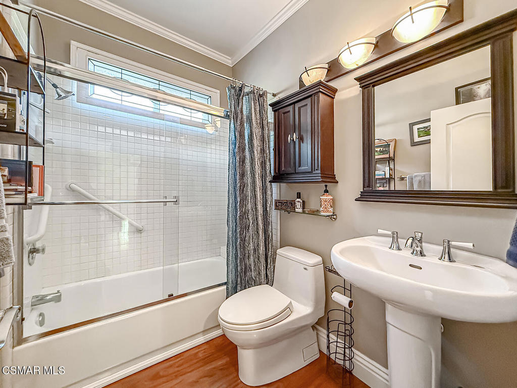 7204 University Drive Moorpark, CA 93021 - Photo 22 of 57 a bathroom with a sink toilet and shower