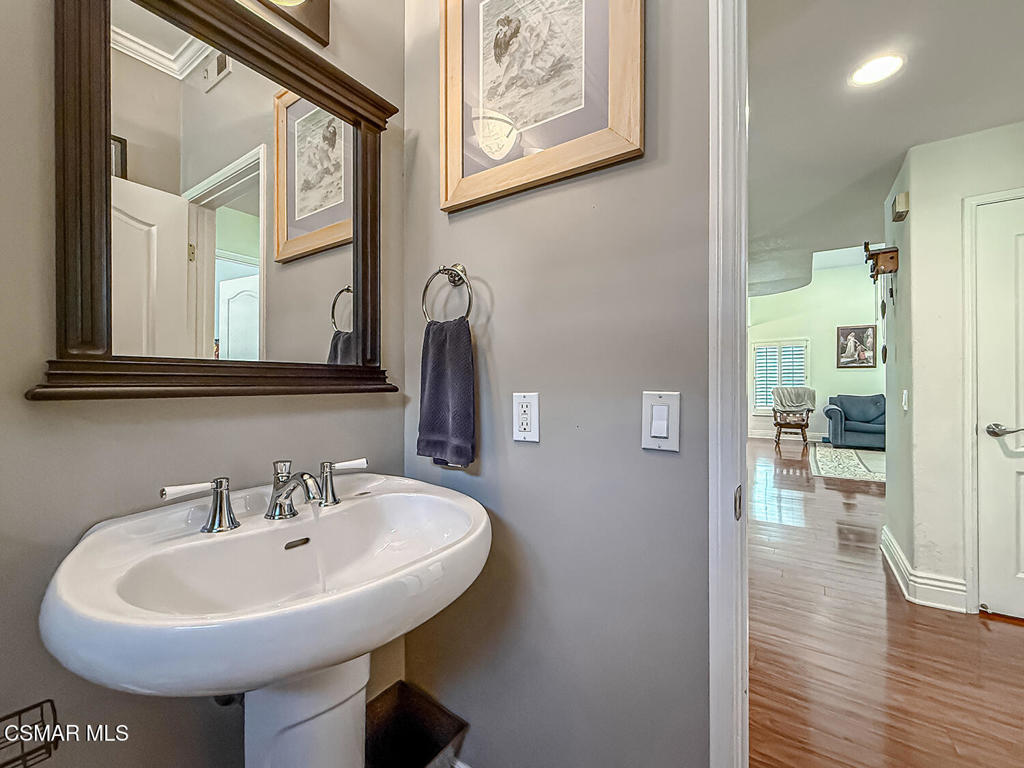 7204 University Drive Moorpark, CA 93021 - Photo 23 of 57 a bathroom with a sink and a mirror
