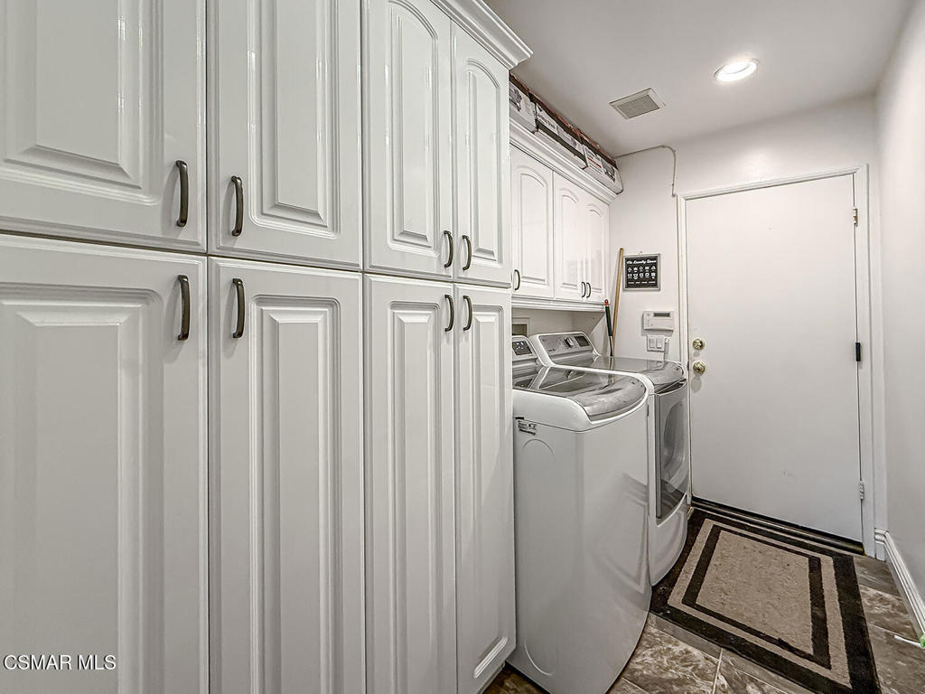 7204 University Drive Moorpark, CA 93021 - Photo 24 of 57 a view of a storage and utility room with racks on the wall
