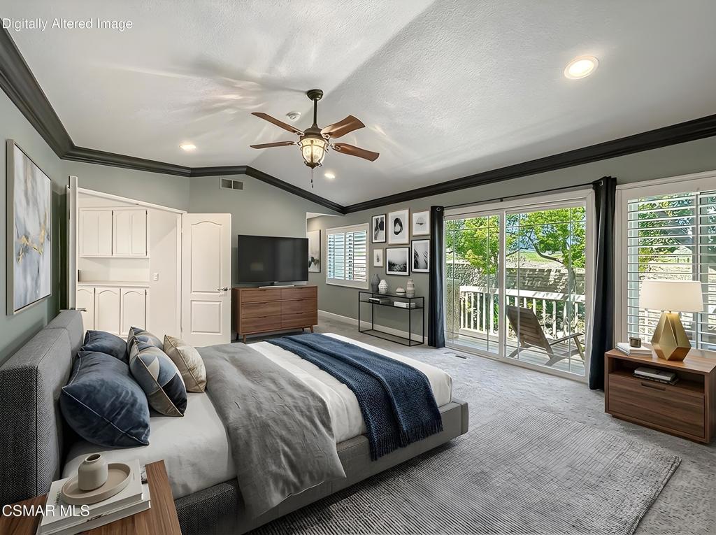 7204 University Drive Moorpark, CA 93021 - Photo 28 of 57 a bedroom with a bed a flat screen tv and a couch