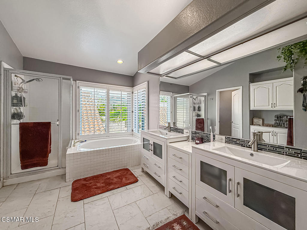 7204 University Drive Moorpark, CA 93021 - Photo 29 of 57 a kitchen with stainless steel appliances granite countertop a stove a sink and a refrigerator