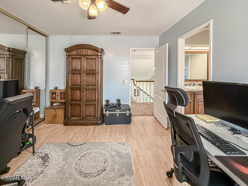 7204 University Drive Moorpark, CA 93021 - Photo 36 of 57 a view of a workspace with furniture and a flat screen tv
