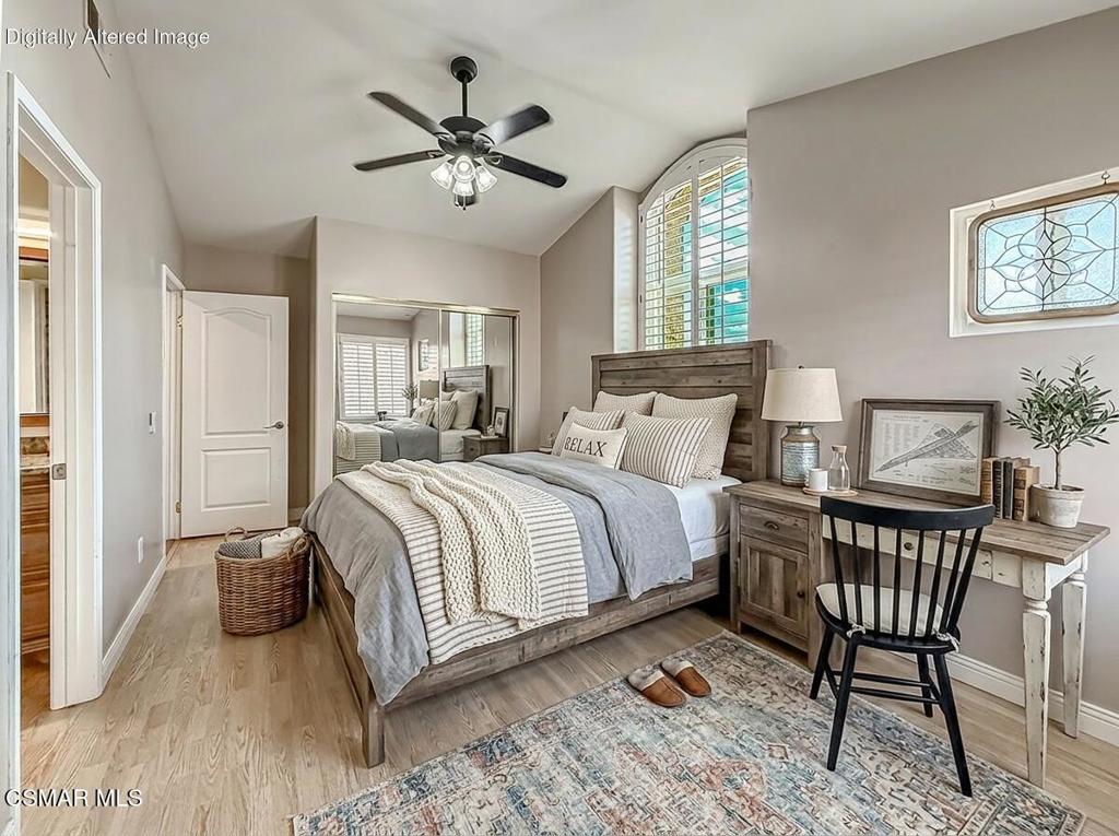 7204 University Drive Moorpark, CA 93021 - Photo 37 of 57 a bedroom with a bed a chandelier and a dresser