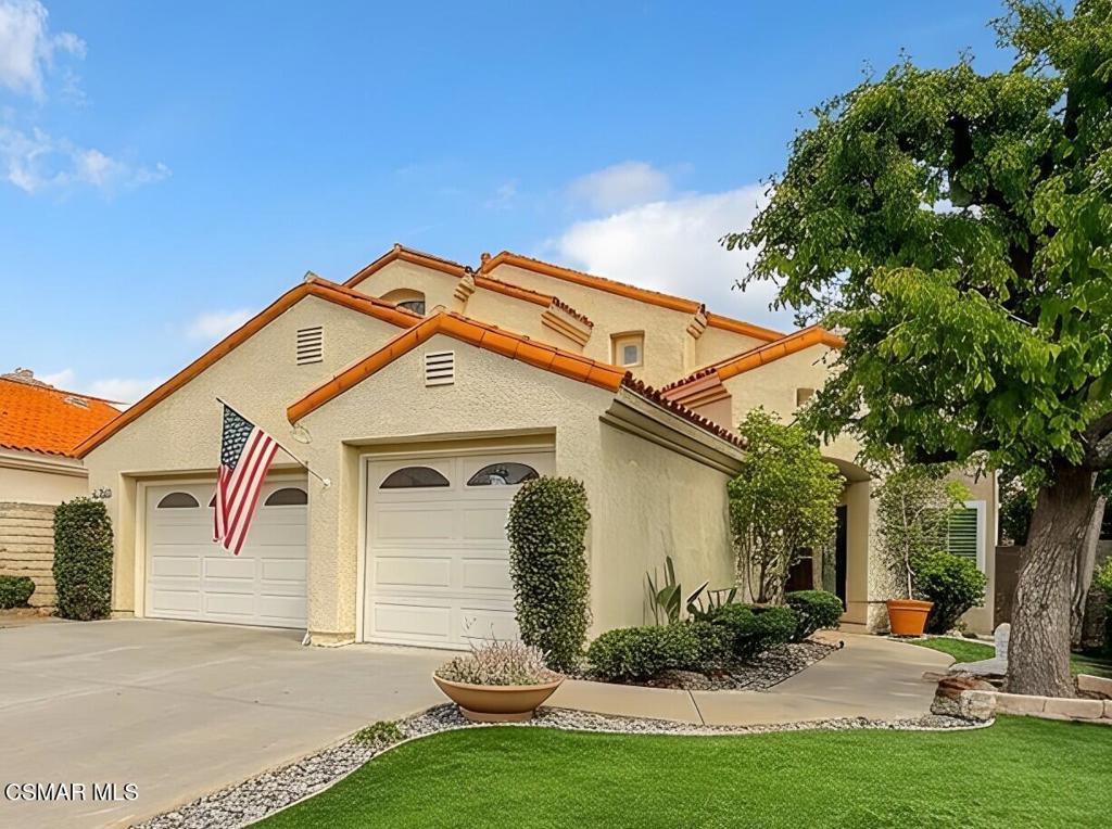 7204 University Drive Moorpark, CA 93021 - Photo 4 of 57 a front view of a house with garden