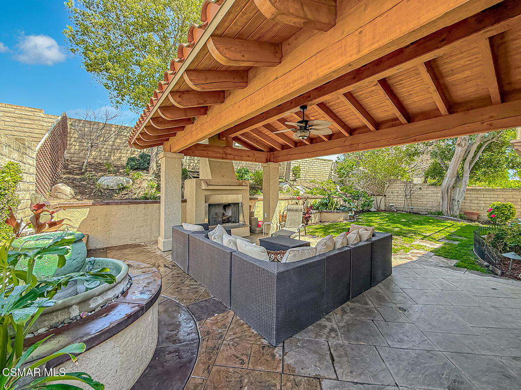 7204 University Drive Moorpark, CA 93021 - Photo 41 of 57 a view of a patio with table and chairs potted plants with sky view