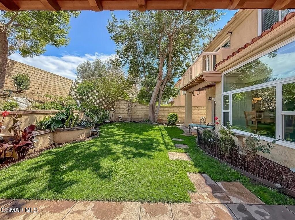 7204 University Drive Moorpark, CA 93021 - Photo 44 of 57 a view of a house with a yard and plants