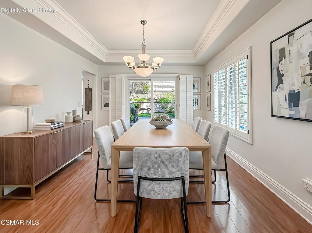 7204 University Drive Moorpark, CA 93021 - Photo 9 of 57 a view of a dining room with furniture wooden floor and chandelier
