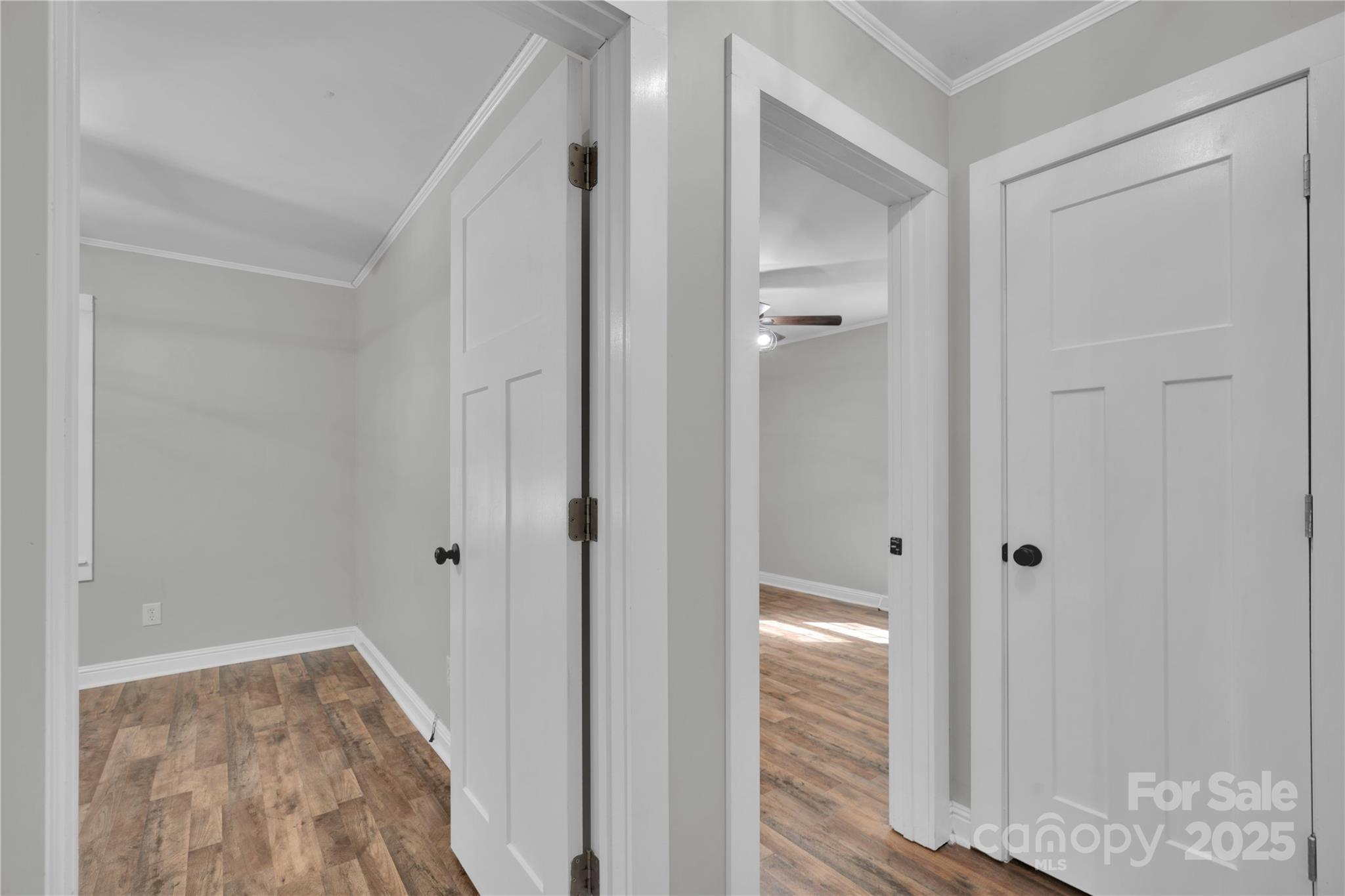 4612 Huggins Road Marshville, NC 28103 - Photo 11 of 37 a view of a hallway with wooden floor and closet area