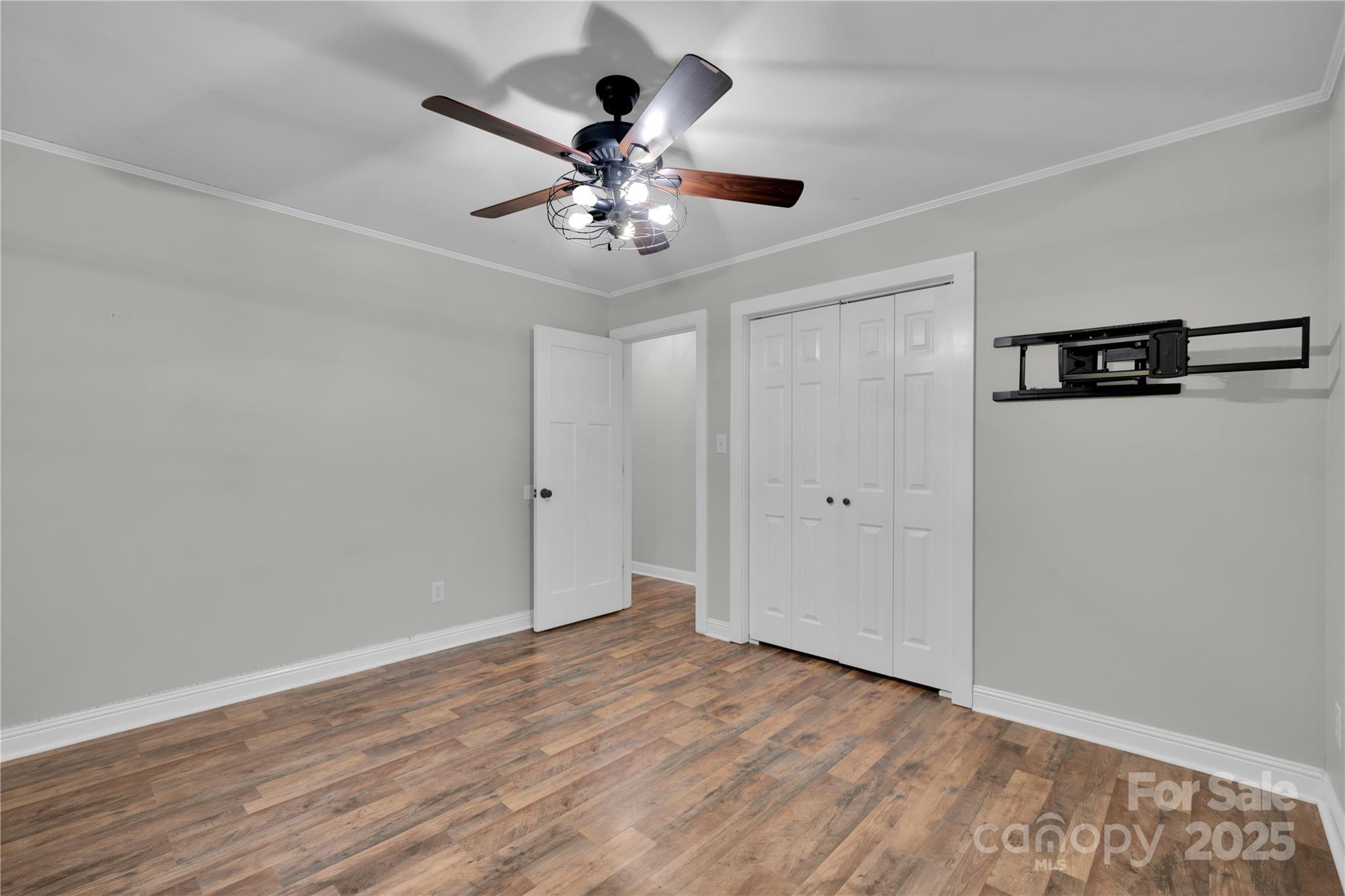 4612 Huggins Road Marshville, NC 28103 - Photo 13 of 37 a view of an empty room with wooden floor