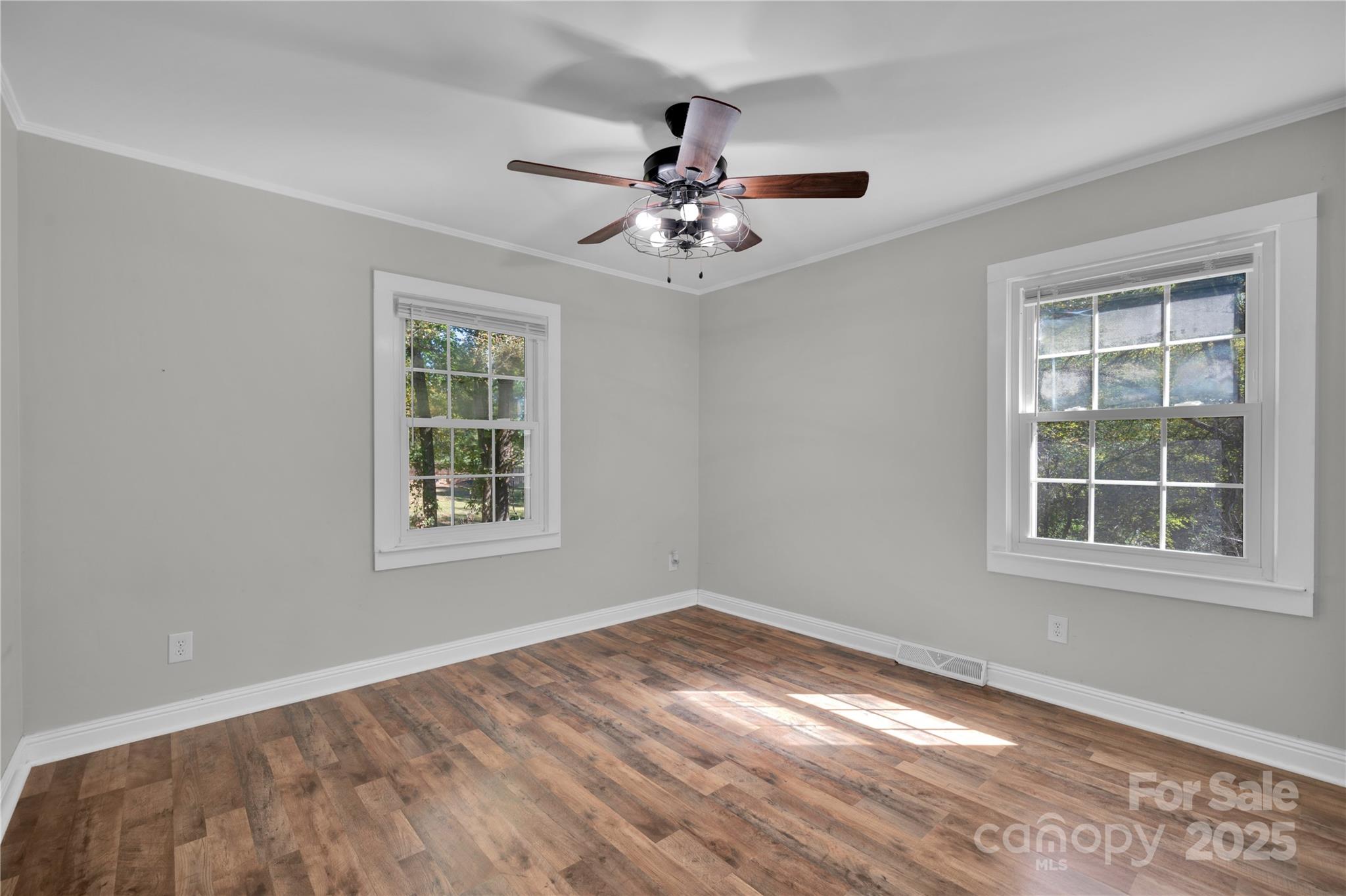 4612 Huggins Road Marshville, NC 28103 - Photo 14 of 37 an empty room with windows and fan