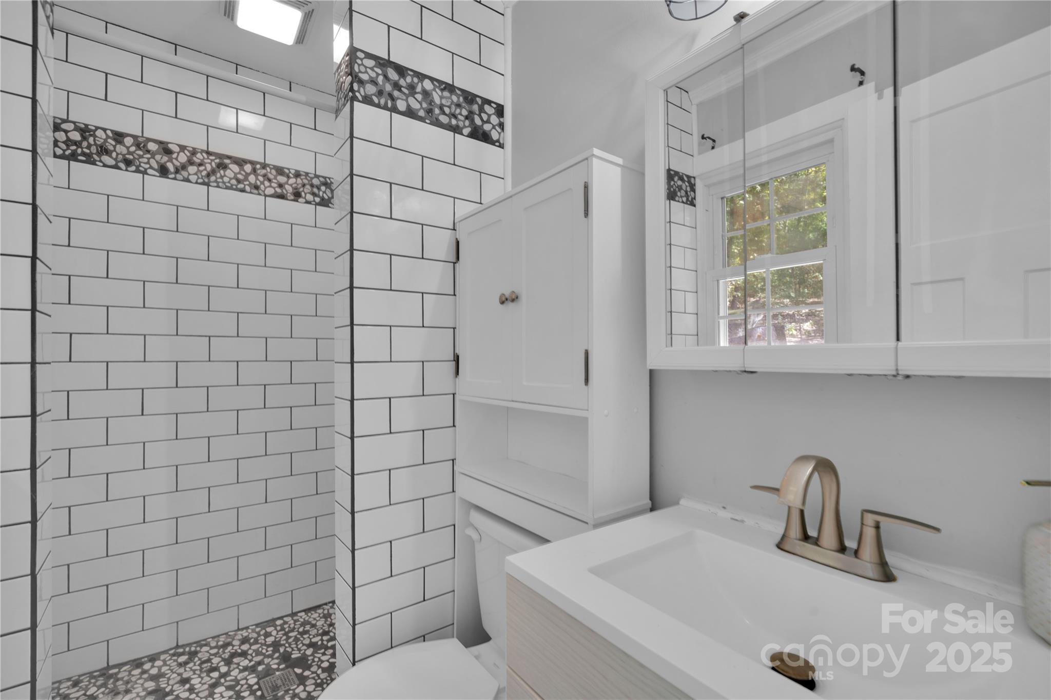 4612 Huggins Road Marshville, NC 28103 - Photo 19 of 37 a bathroom with a sink toilet and shower