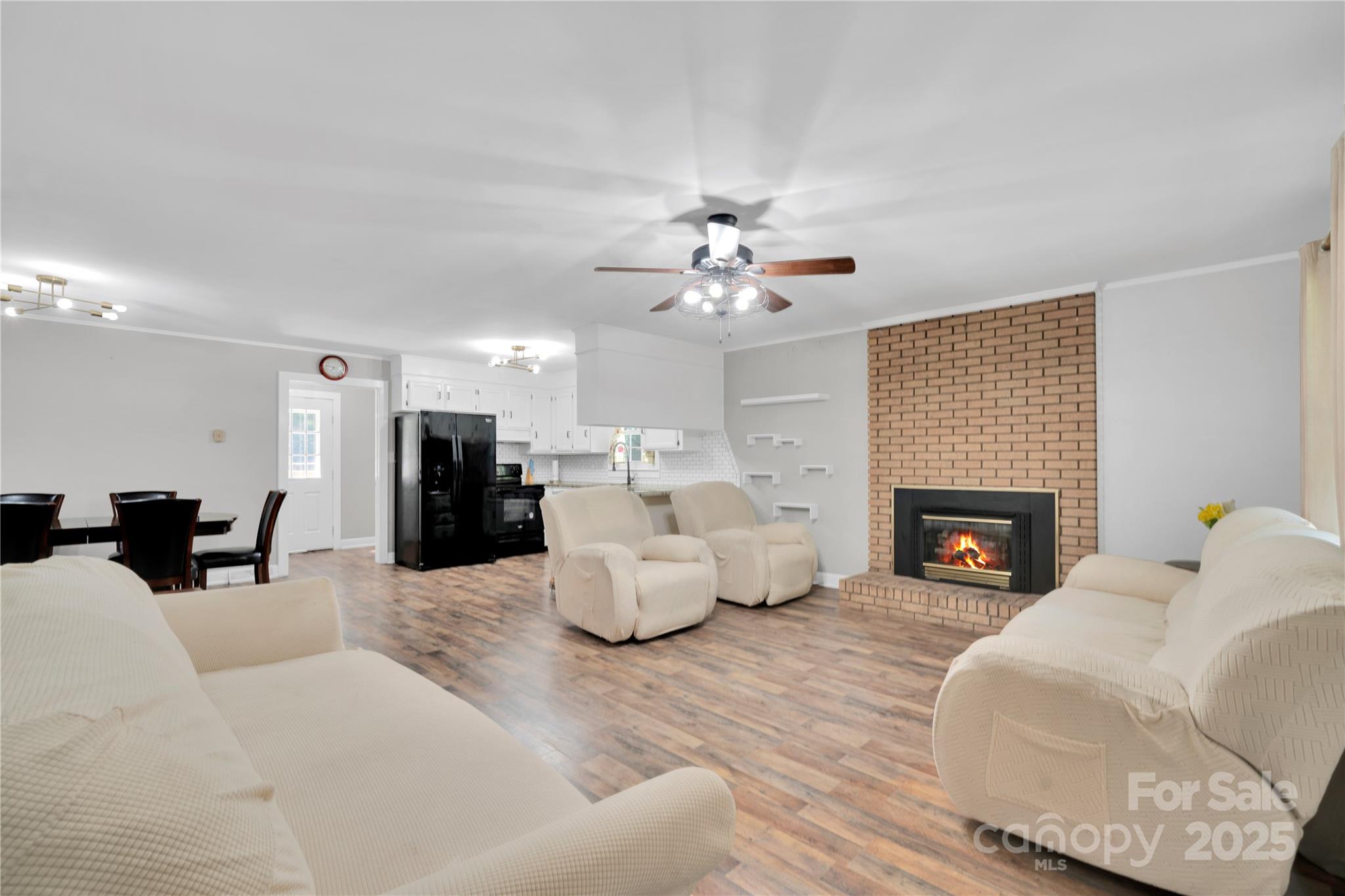 4612 Huggins Road Marshville, NC 28103 - Photo 2 of 37 a living room with furniture and a fireplace